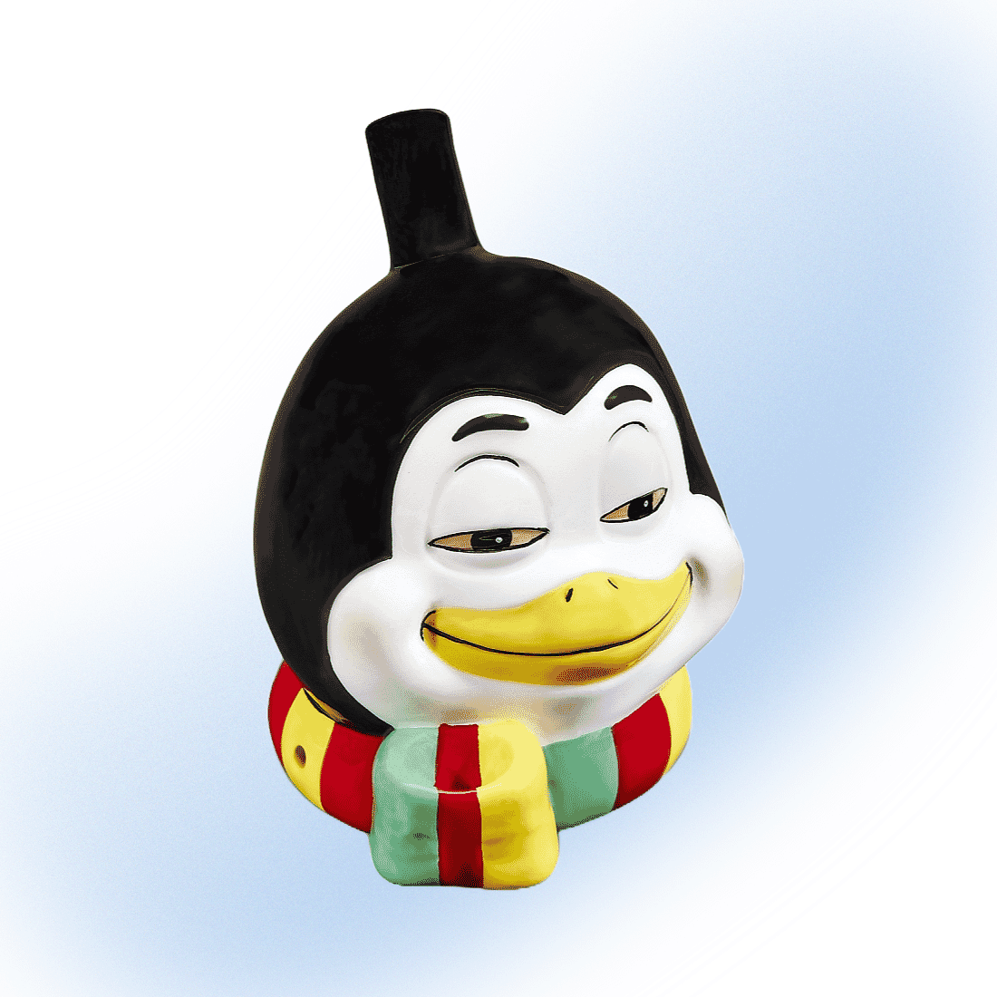 Cartoon-style ceramic penguin head smoking pipe with a scarf, from Fashioncraft.