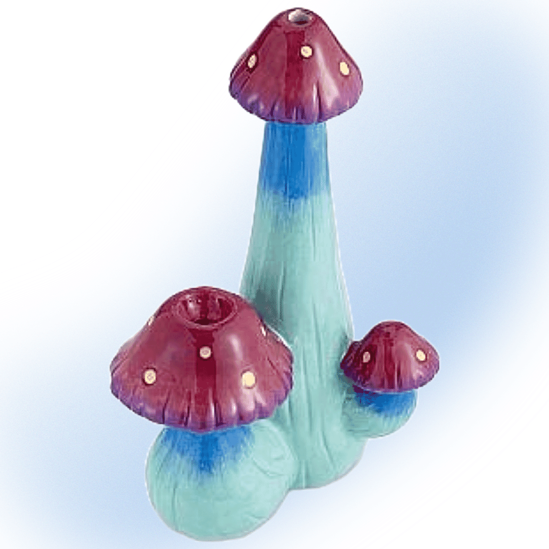 Ceramic cannabis pipe with a triple mushroom design, offering a unique and decorative look.