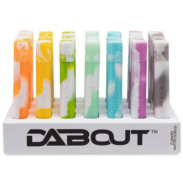 Dab Out All-in-one Kit glowing in the dark, showcasing quartz nectar collector, resin dugout, and dab tool.