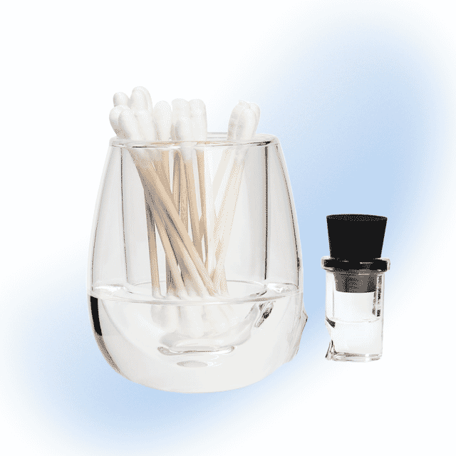 High Five Clear Glass Iso Station for storing Q-tips and isopropyl alcohol.