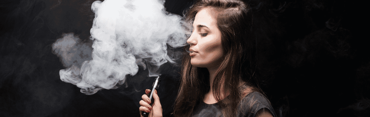 E-Cigarette User Blowing Vapor